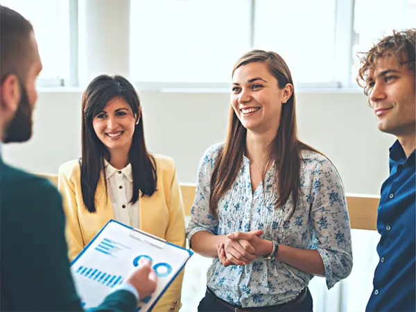 Image of Manager chatting with Employees